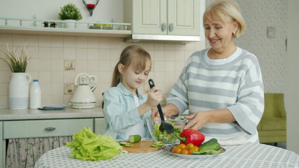 Woman preparing a fresh vegetable-based meal at home, healthy habit to support liver function