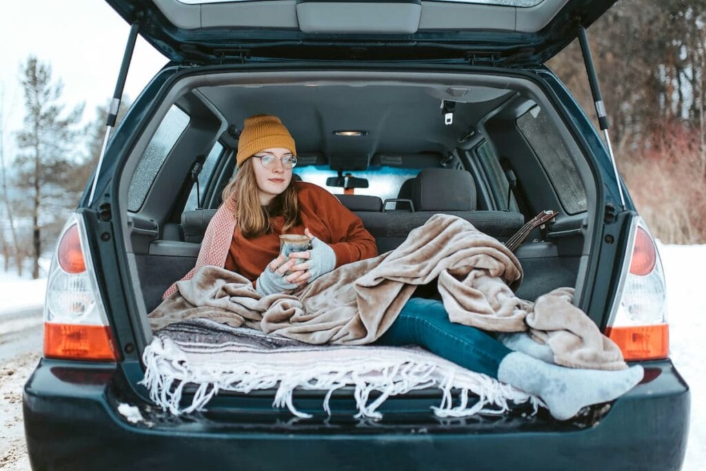 Woman keeping a spare shirt in her car, coping with unpredictable hot flashes during menopause, natural hormone support supplement concept