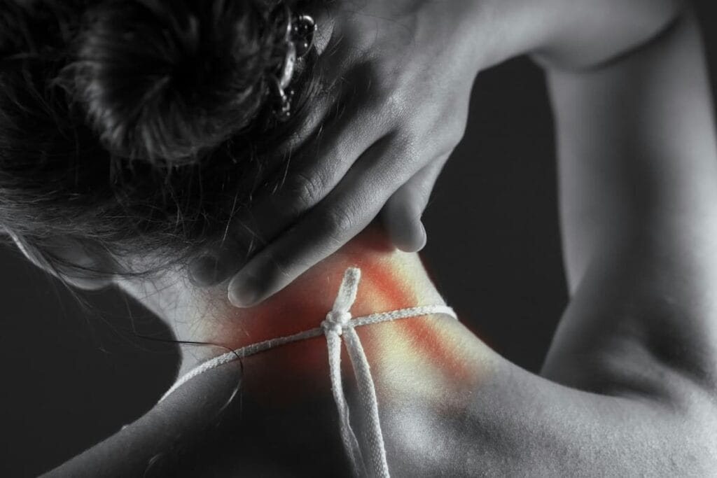Woman doing a gentle neck stretch in the morning, healthy habit alongside proper pillow support